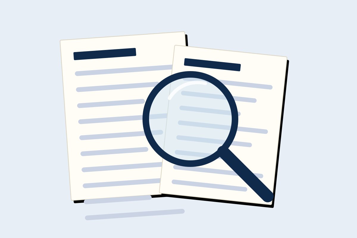 A magnifying glass over two documents