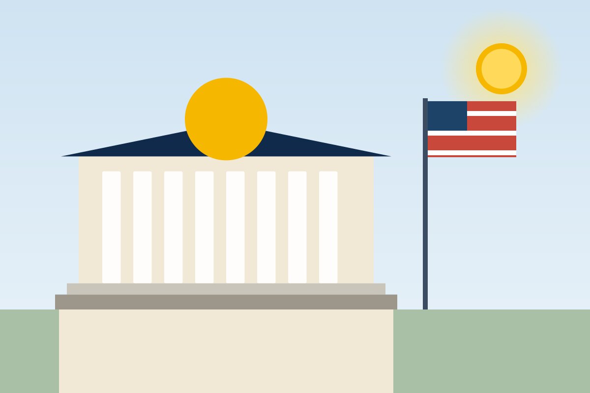A town hall with a flag in front